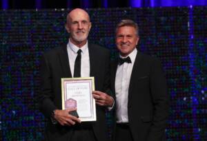 Mark Browning with Dean Warren (AFLQ Chair) at the 2023 AFLQ Hall of Fame Induction evening