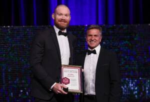 Pictured: Daniel Merrett and Dean Warren (AFLQ Chair) at the 2023 AFLQ Hall of Fame Induction evening