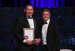 Geoff Pemberton and Dean Warren (AFLQ Chair) at the 2023 AFLQ Hall of Fame Induction evening